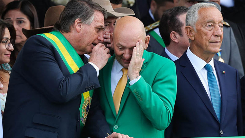   [COLUNA ESPLANADA] Em plena comemoração dos 200 anos da Independência do Brasil, foi tão fria a relação do presidente Jair Bolsonaro com o convidado Marcelo Rebelo, presidente de Portugal, a ponto de lembrar a tensa relação da Coroa com o Brasil imperial. O cerimonial de Bolsonaro cometeu a gafe de deixar o empresário Luciano Hang, da Havan, ao lado do presidente – ofuscando assim a presença do convidado ilustre. O ‘véio da Havan’ teve mais atenção que o convidado ilustre. Bolsonaro e Rebelo mal se falaram. Ao fim do dia, a Embaixada de Portugal promoveu uma recepção comemorativa para cidadãos portugueses e brasileiros com cidadania, com a presença do chefe de Estado europeu. Nenhuma autoridade do Palácio do Planalto apareceu. O clima já não estava bom entre os dois presidentes desde que, há dois meses, Bolsonaro desmarcou uma reunião entre eles, a convite do brasileiro, porque Rebelo se reuniu com Lula da Silva.